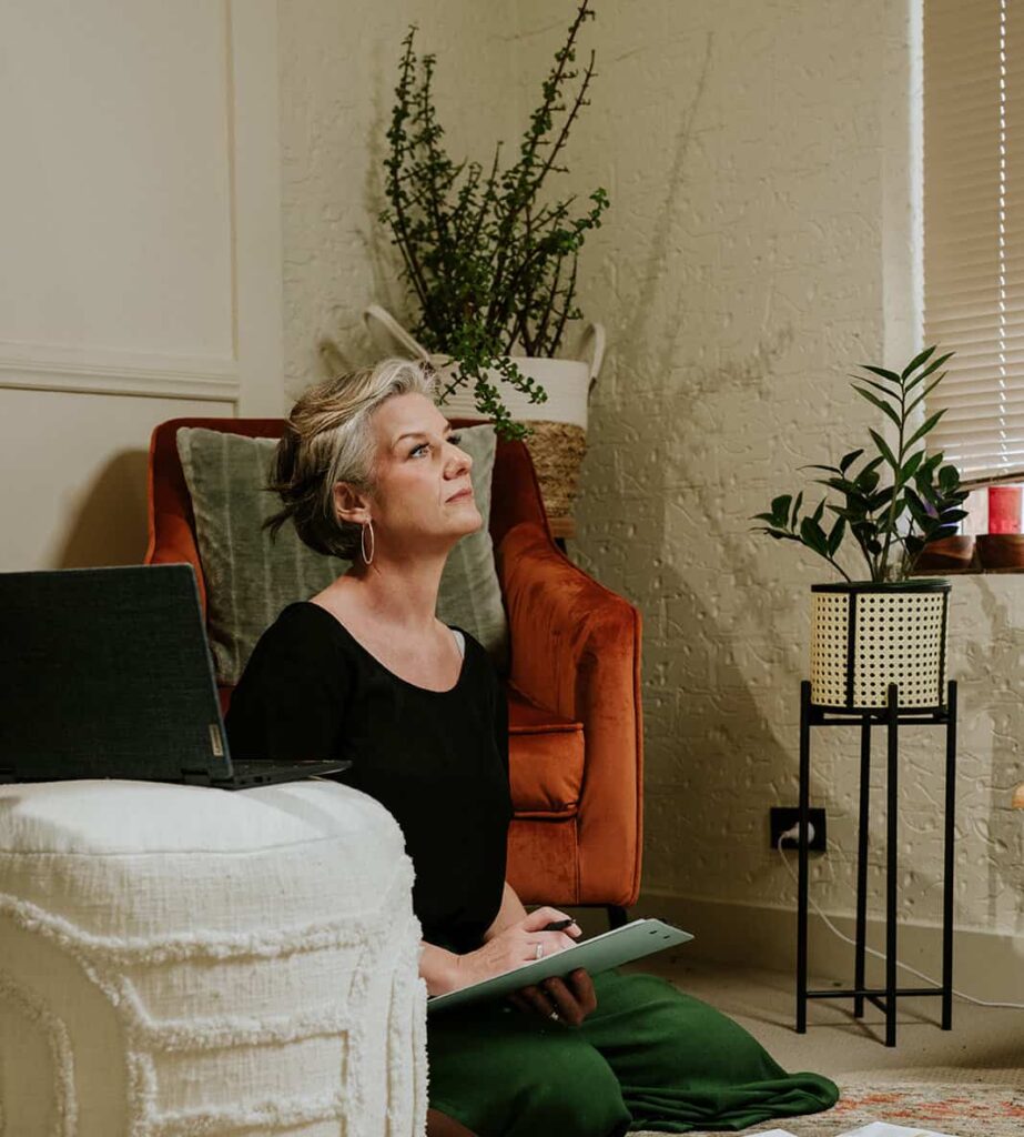 A Reflection on 2025: Holding Change Without Gripping It 1 Tracy sitting on floor reflecting.